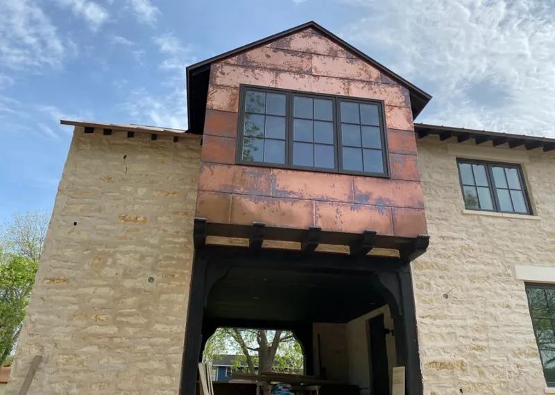 Copper metal panel facade on a stone building for Metal Roof Coating in Pine Hill